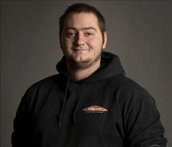 male servpro employee in front of blank background