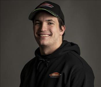 male servpro employee in front of blank background