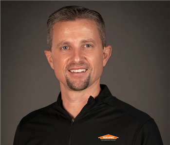 male servpro employee in front of blank background