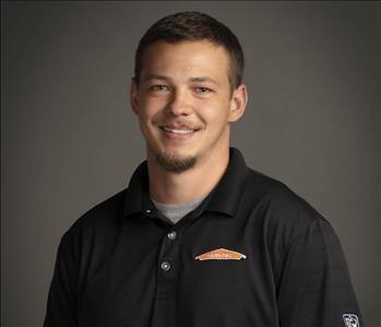 male servpro employee in front of blank background