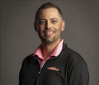 male servpro employee in front of blank background